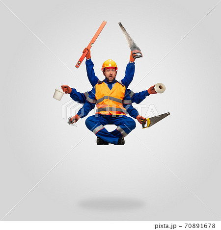 Handsome contractor, multi-armed builder levitating isolated on grey studio background 70891678