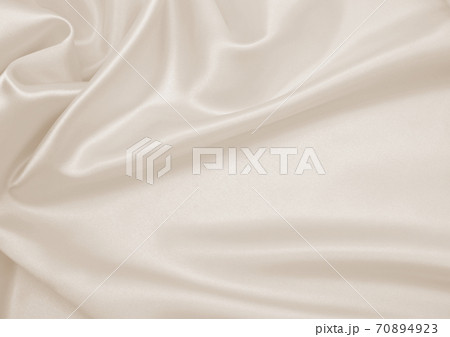 Smooth elegant golden silk or satin luxury cloth texture as wedding background. Luxurious background design. In Sepia toned. Retro style Smooth elegant golden silk or satin luxury cloth texture as wedding background. Luxurious background design. In Sepia toned. Retro style 70894923