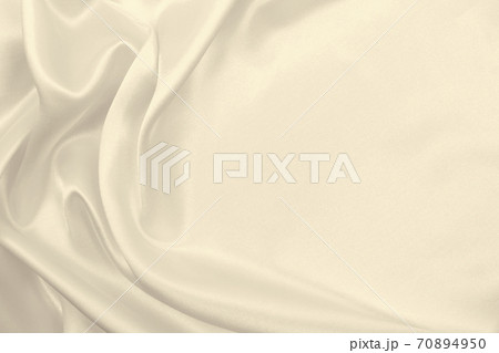 Smooth elegant golden silk or satin luxury cloth texture as wedding background. Luxurious background design. In Sepia toned. Retro style Smooth elegant golden silk or satin luxury cloth texture as wedding background. Luxurious background design. In Sepia toned. Retro style 70894950