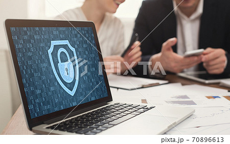 Laptop with closed padlock icon and binary code on screen Laptop with closed padlock icon and binary code on screen 70896613