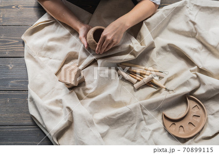 Table with materials and tools for pottery making craftsperson workspace creative studio top view 70899115