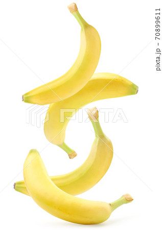 Bananas fall on a white background, levitating bananas. Isolated Bananas fall on a white background, levitating bananas. Isolated 70899611