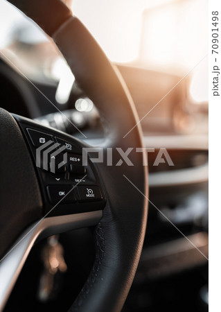 MURES, ROMANIA - OCTOBER 21, 2020, interior view of brand new Hyundai Tucson 2020. Leather covered wheel with audio control buttons. MURES, ROMANIA - OCTOBER 21, 2020, interior view of brand new Hyundai Tucson 2020. Leather covered wheel with audio control buttons. 70901498