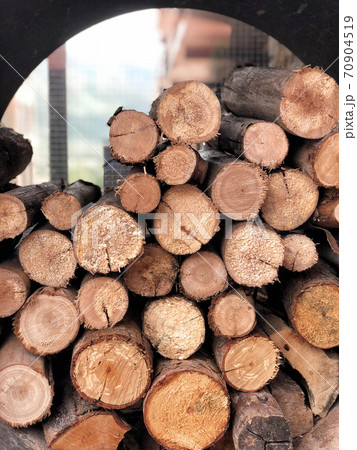 A pile of stacked firewood, prepared for cooking pizza in the Restaurant 70904519