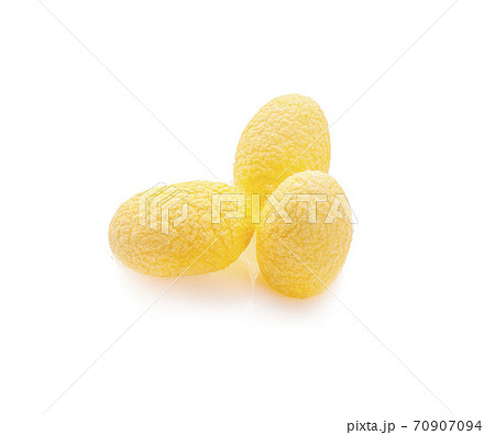 yellow thai silkworm cocoons pile isolated on white background 70907094
