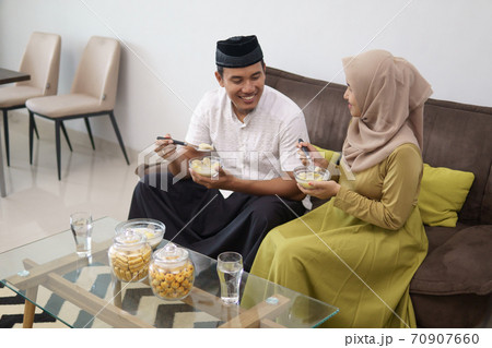couple having some food for breaking the fast couple having some food for breaking the fast 70907660