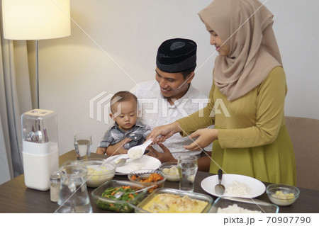 muslim family with toddler breakfasting during ramadan 70907790