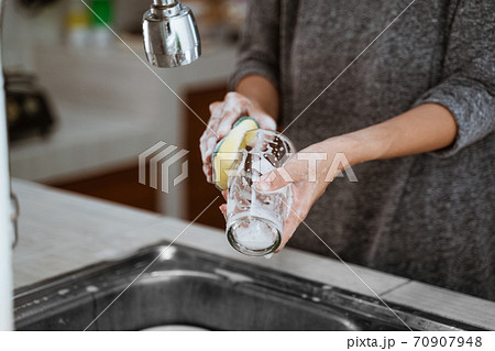 woman is washing dishes 70907948