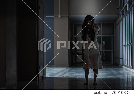 woman ghost creepy in a dark room at house woman ghost creepy in a dark room at house 70910835