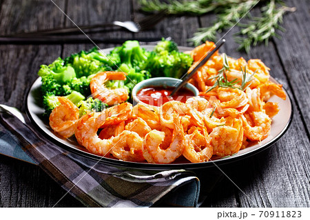 Garlic butter prawns with broccoli, top view Garlic butter prawns with broccoli, top view 70911823