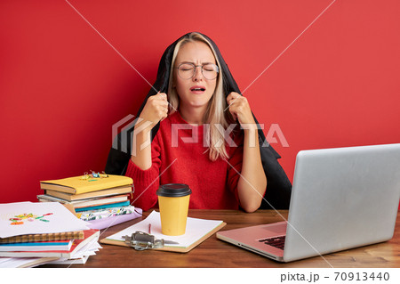 young beautiful sad and depressed caucasian manager working in stress at office computer desk 70913440