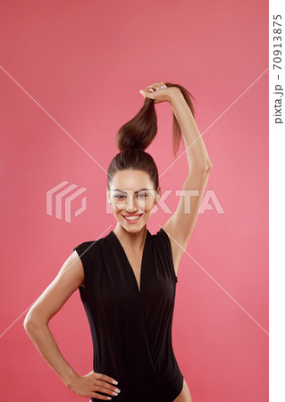 Portrait of woman with beautiful long hair. Beauty model girl with brown straight long hair . Care and hair products Portrait of woman with beautiful long hair. Beauty model girl with brown straight long hair . Care and hair products 70913875