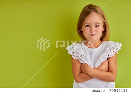 dissatisfied little girl look at camera, puff out dissatisfied little girl look at camera, puff out 70915151