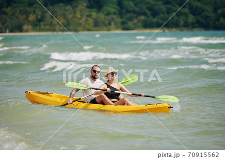 Couple paddling kayak Couple paddling kayak 70915562