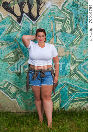 Curvy woman in summery clothes. Curvy woman in summery clothes. 70916794