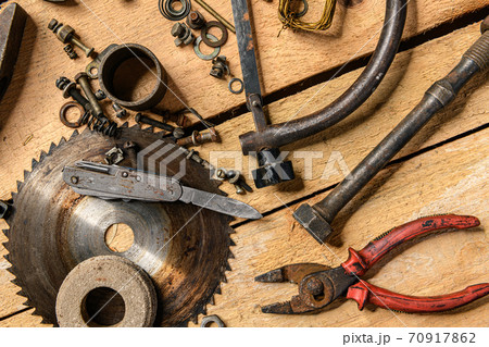 Variety of old vintage household hand tools still life on a wooden background in a DIY and repair concept 70917862