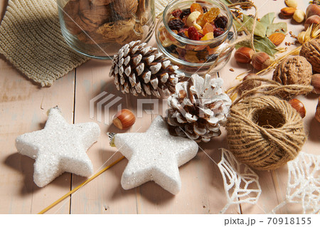 christmas decoration in rustic style and holiday background, still life on wooden backdrop, bread, nuts and other christmas decoration in rustic style and holiday background, still life on wooden backdrop, bread, nuts and other 70918155