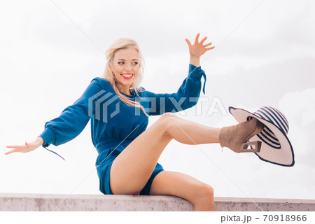 Fashion model wearing blue jumpsuit Fashion model wearing blue jumpsuit 70918966