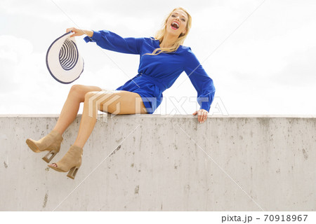 Fashion model wearing blue jumpsuit Fashion model wearing blue jumpsuit 70918967