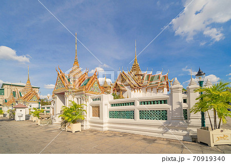 Golden pagoda at Temple of the Emerald Buddha in Bangkok, Thailand. Wat Phra Kaew and Grand palace in old town, urban city. Buddhist temple, Thai architecture. A tourist attraction 70919340