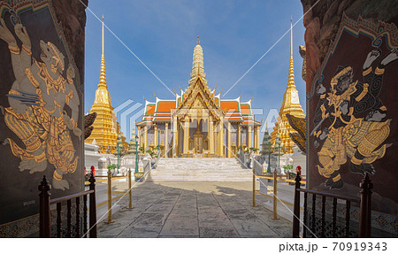 Golden pagoda at Temple of the Emerald Buddha in Bangkok, Thailand. Wat Phra Kaew and Grand palace in old town, urban city. Buddhist temple, Thai architecture. A tourist attraction 70919343