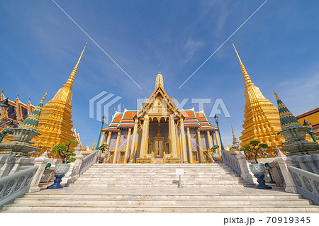 Golden pagoda at Temple of the Emerald Buddha in Bangkok, Thailand. Wat Phra Kaew and Grand palace in old town, urban city. Buddhist temple, Thai architecture. A tourist attraction 70919345
