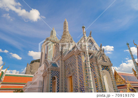 Golden pagoda at Temple of the Emerald Buddha in Bangkok, Thailand. Wat Phra Kaew and Grand palace in old town, urban city. Buddhist temple, Thai architecture. A tourist attraction Golden pagoda at Temple of the Emerald Buddha in Bangkok, Thailand. Wat Phra Kaew and Grand palace in old town, urban city. Buddhist temple, Thai architecture. A tourist attraction 70919370