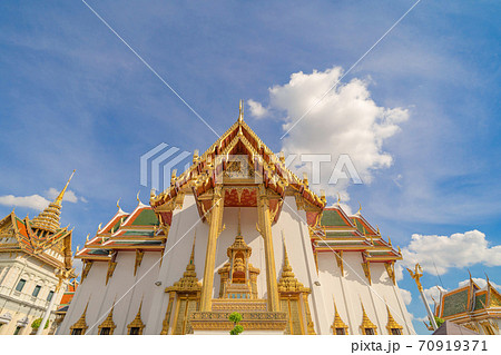 Golden pagoda at Temple of the Emerald Buddha in Bangkok, Thailand. Wat Phra Kaew and Grand palace in old town, urban city. Buddhist temple, Thai architecture. A tourist attraction 70919371