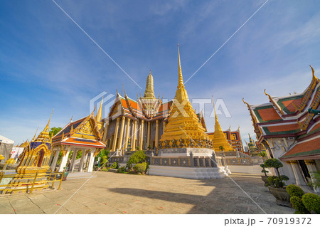 Golden pagoda at Temple of the Emerald Buddha in Bangkok, Thailand. Wat Phra Kaew and Grand palace in old town, urban city. Buddhist temple, Thai architecture. A tourist attraction 70919372