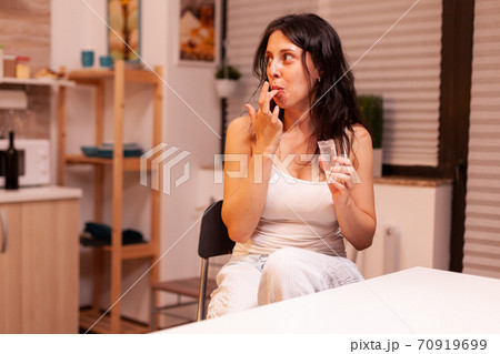 Woman looking at husband 70919699