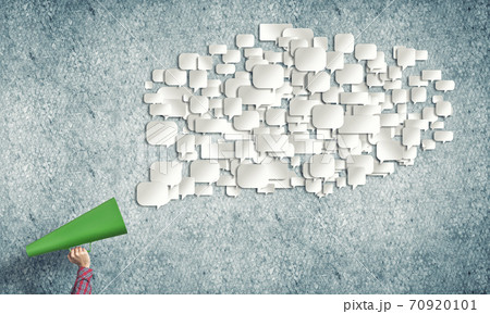 Hand of woman holding red paper trumpet and speech cloud Hand of woman holding red paper trumpet and speech cloud 70920101