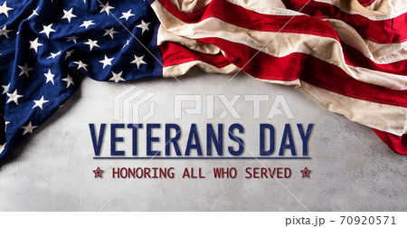 Happy Veterans Day concept. American flags against gray stone  background. November 11. 70920571
