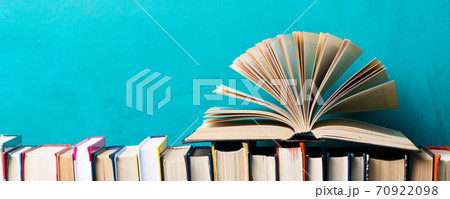 Books on wooden desk table and abstract background. Education background. Copy Space. Back to school. Books on wooden desk table and abstract background. Education background. Copy Space. Back to school. 70922098