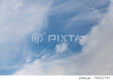 Cirrocumulus clouds in the light blue sky background Cirrocumulus clouds in the light blue sky background 70922747