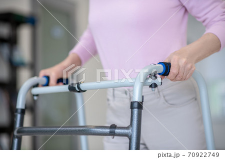 Close up of elderly woman with a rolling-walker Close up of elderly woman with a rolling-walker 70922749