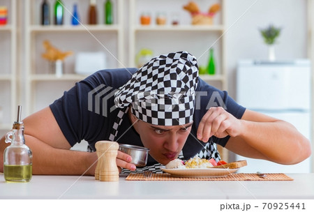Chef cook cooking a meal breakfast dinner in the kitchen Chef cook cooking a meal breakfast dinner in the kitchen 70925441
