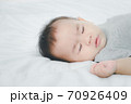 Close up baby girl sleeping on bed. 70926409