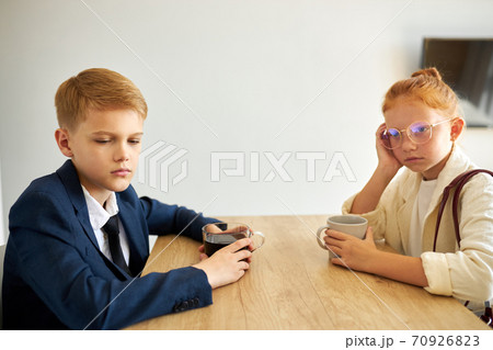 depressed sleepy boy and girl at home before school 70926823