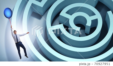 Businessman escaping from maze on balloon 70927951