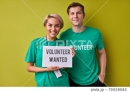 two caucasian man and woman waiting for new people in their charity organization 70928683