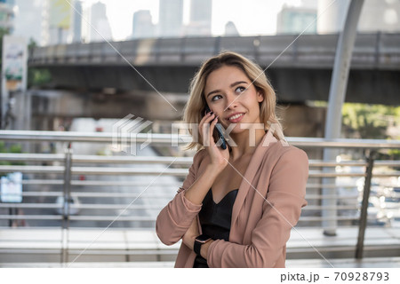 Happy American businesswoman talk on phone Happy American businesswoman talk on phone 70928793