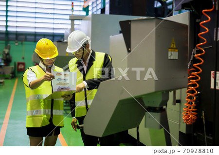 Factory auditor check mockup model at drilling machine 70928810