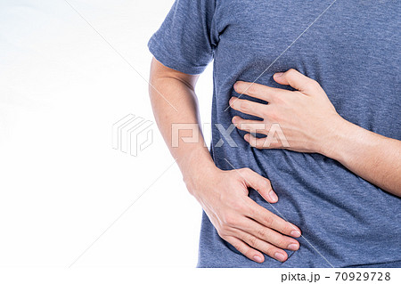 Man hand touching stomach, waist, or liver position isolated white background. Man hand touching stomach, waist, or liver position isolated white background. 70929728