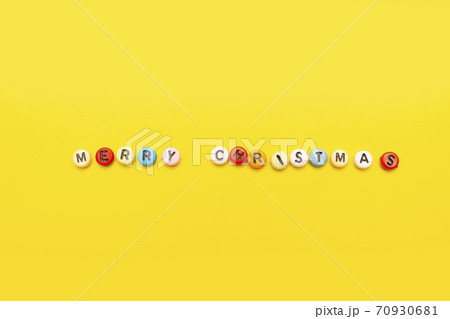 Christmas composition minimalism spelled merry christmas on yellow background 70930681
