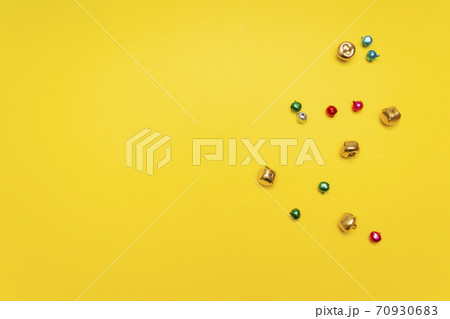 Christmas bells on yellow background, celebration design 70930683