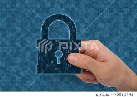 Illustration of hand holding closed padlock with keyhole icon 70931442