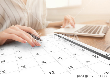 Business Scheduling. Unrecognizable Woman Working On Laptop And Checking Calendar At Workplace 70931555