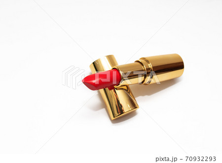 Red lipstick in gold tube on white background. Copy space, close-up  70932293