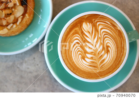 cup of hot latte art coffee 70940070