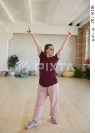 Woman exercising in studio Woman exercising in studio 70940196